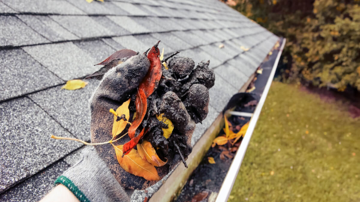 hand cleaning gutter